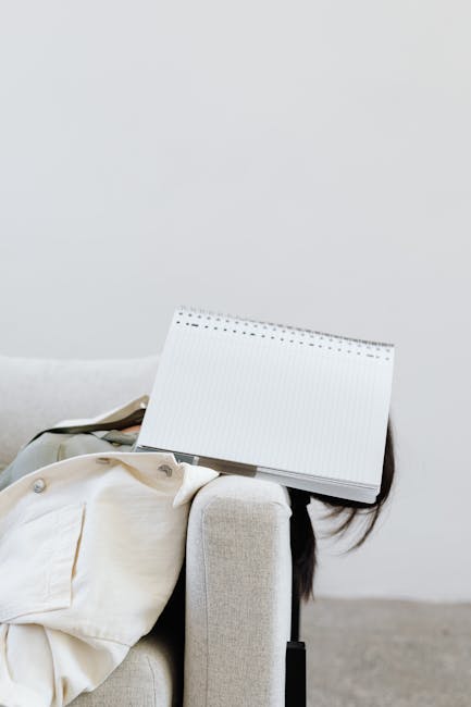 Calm woman meditating at her desk during a work break