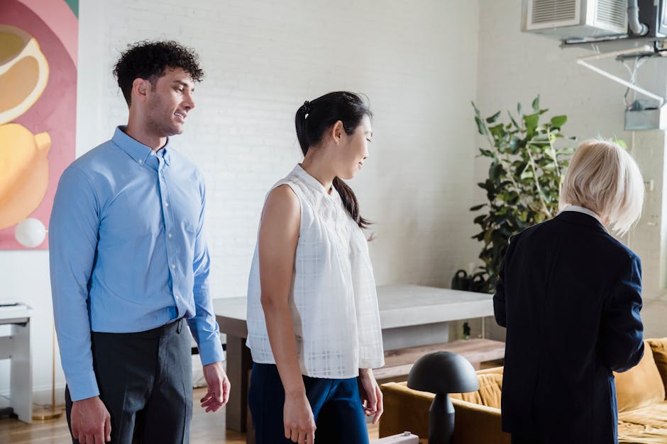 Group of smiling people doing light stretches in a modern office